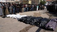 Mourners pray over the bodies of 10 members of the Abu Al-Rous family, killed when an Israeli airstrike struck their displacement tent overnight, during their funeral in Khan Younis, southern Gaza Strip, Thursday, April 17, 2025. (AP Photo/Abdel Kareem Hana)