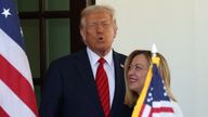 U.S. President Donald Trump greets Italian Prime Minister Giorgia Meloni upon her arrival at the White House in Washington, D.C., U.S., April 17, 2025. REUTERS/Kevin Lamarque
