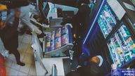 Officers tackle shop thieves. Pic: Met Police