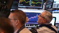 Traders work on the floor at the New York Stock Exchange in New York, Monday, April 7, 2025. (AP Photo/Seth Wenig)