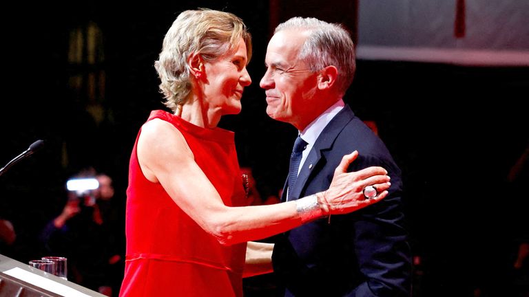 Mark Carney embraces his wife Diana Fox Carney during  election night.
Pic: Reuters