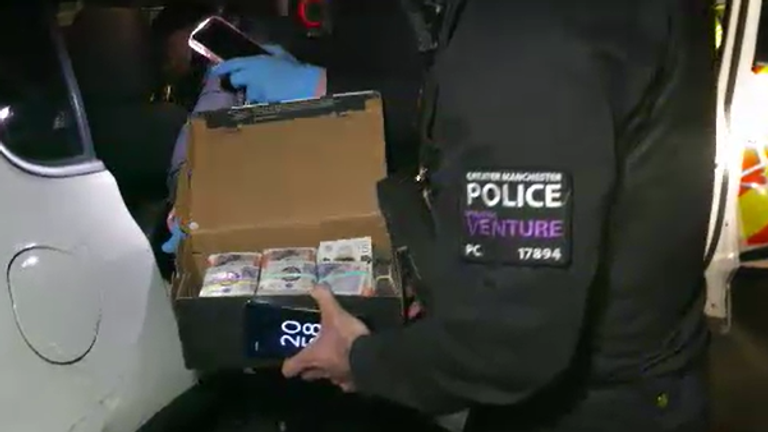 The cash recovered by officers from car - thought to be around £50,000