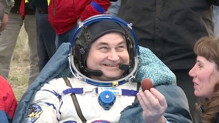 Roscosmos cosmonaut Alexey Ovchinin holds a hard-boiled egg given to him for Easter. Pic: Reuters