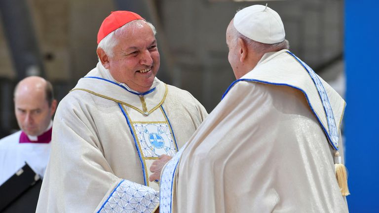 Pope Francis speaks to Marseille's archbishop Cardinal Jean-Marc Aveline, at a mass at the Velodrome Stadium, as a part of his journey on the occasion of the Mediterranean Meetings (MED 2023) in Marseille, France, September 23, 2023. Vatican Media/Handout via REUTERS ATTENTION EDITORS - THIS IMAGE WAS PROVIDED BY A THIRD PARTY.