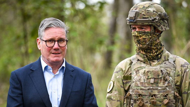 Prime Minister Sir Keir Starmer stands next to a New Zealand soldier during a visit to a military base during a visit to a military base training Ukrainian troops in the West of England. Picture date: Tuesday April 22, 2025. PA Photo. See PA story POLITICS Ukraine. Photo credit should read: Finnbarr Webster/PA Wire