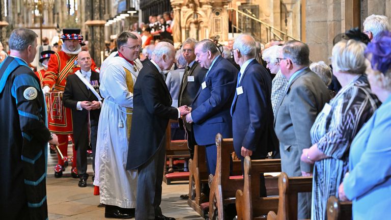 King Charles speaks with a member of the congregation at Durham Cathedral. Pic: PA
