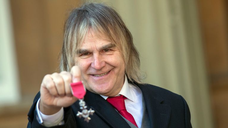 Mike Peters with his MBE. Pic: PA