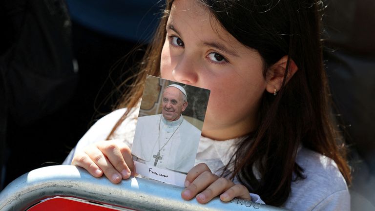A girl waits outside the Papal Basilica of Saint Mary Major. Pic: Reuters