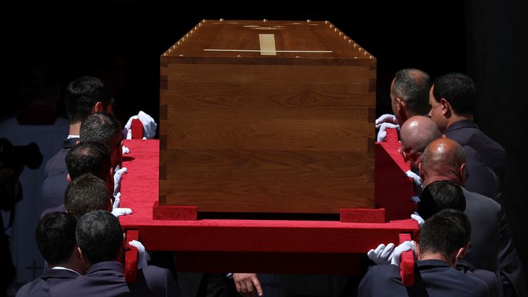 The coffin enters the basilica, a place the Pope prayed at frequently. Pic: Reuters