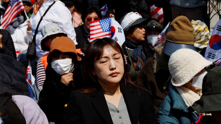 Far-right protester saddened by Yoon Suk Yeol's impeachment. Pic: Reuters