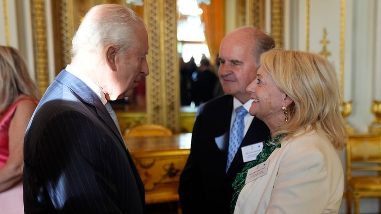 The King talks to Dame Deborah James's parents, Alistair and Heather James. Pic: PA