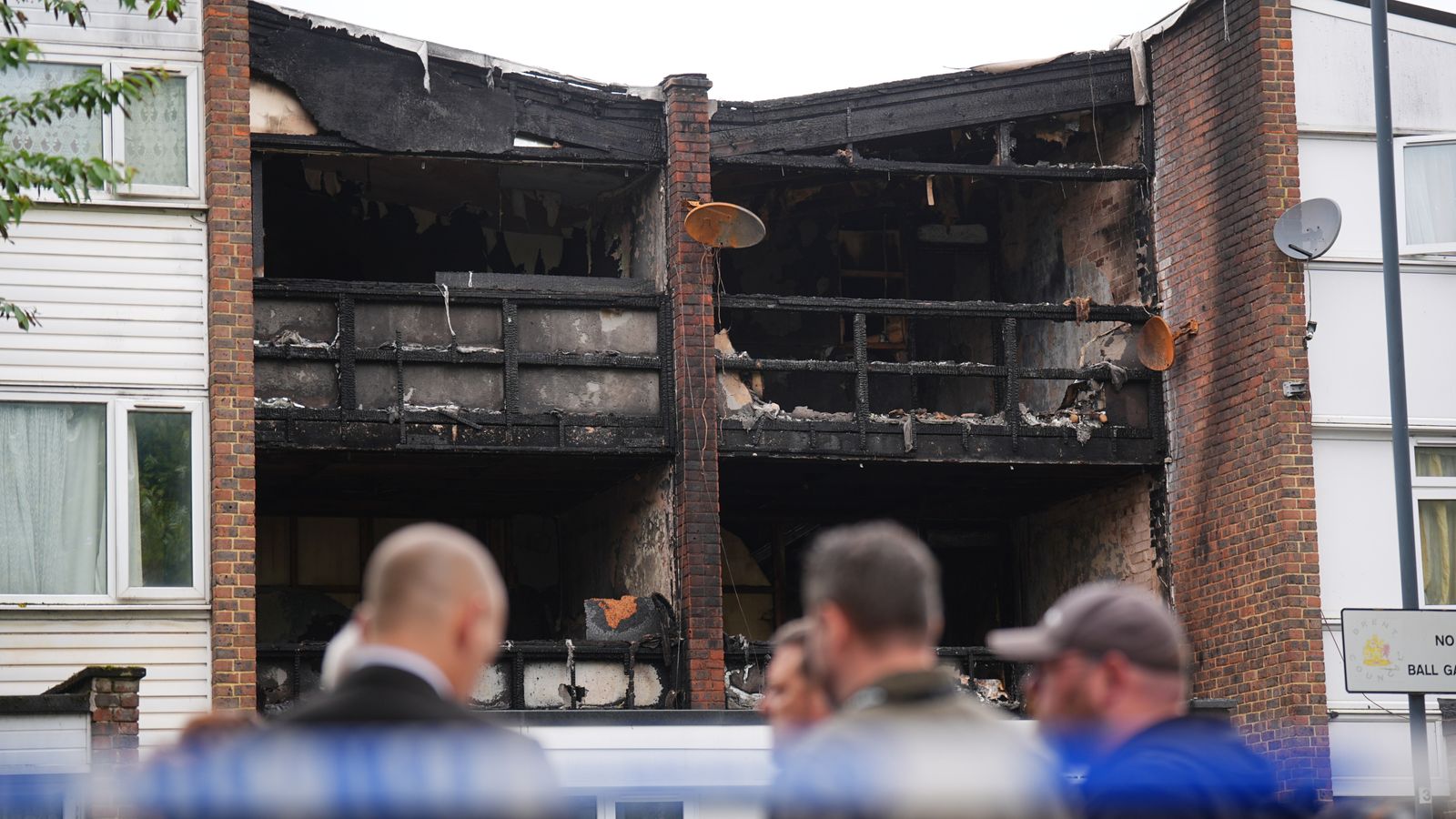 Man arrested on suspicion of murder as three children and a woman die in house fire
