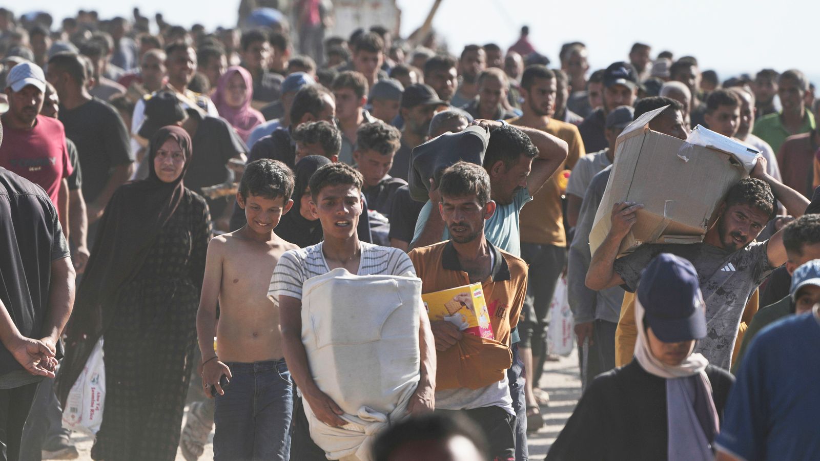 Palestinians flock to Gaza aid centres despite concerns - as lawyers call for sanctions on Israel