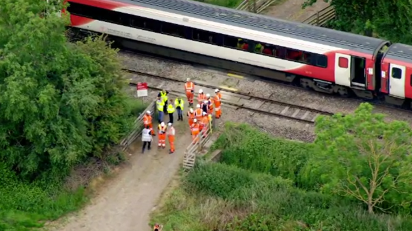 Passengers injured after train hits trailer on level crossing near Leominster - as police arrest man