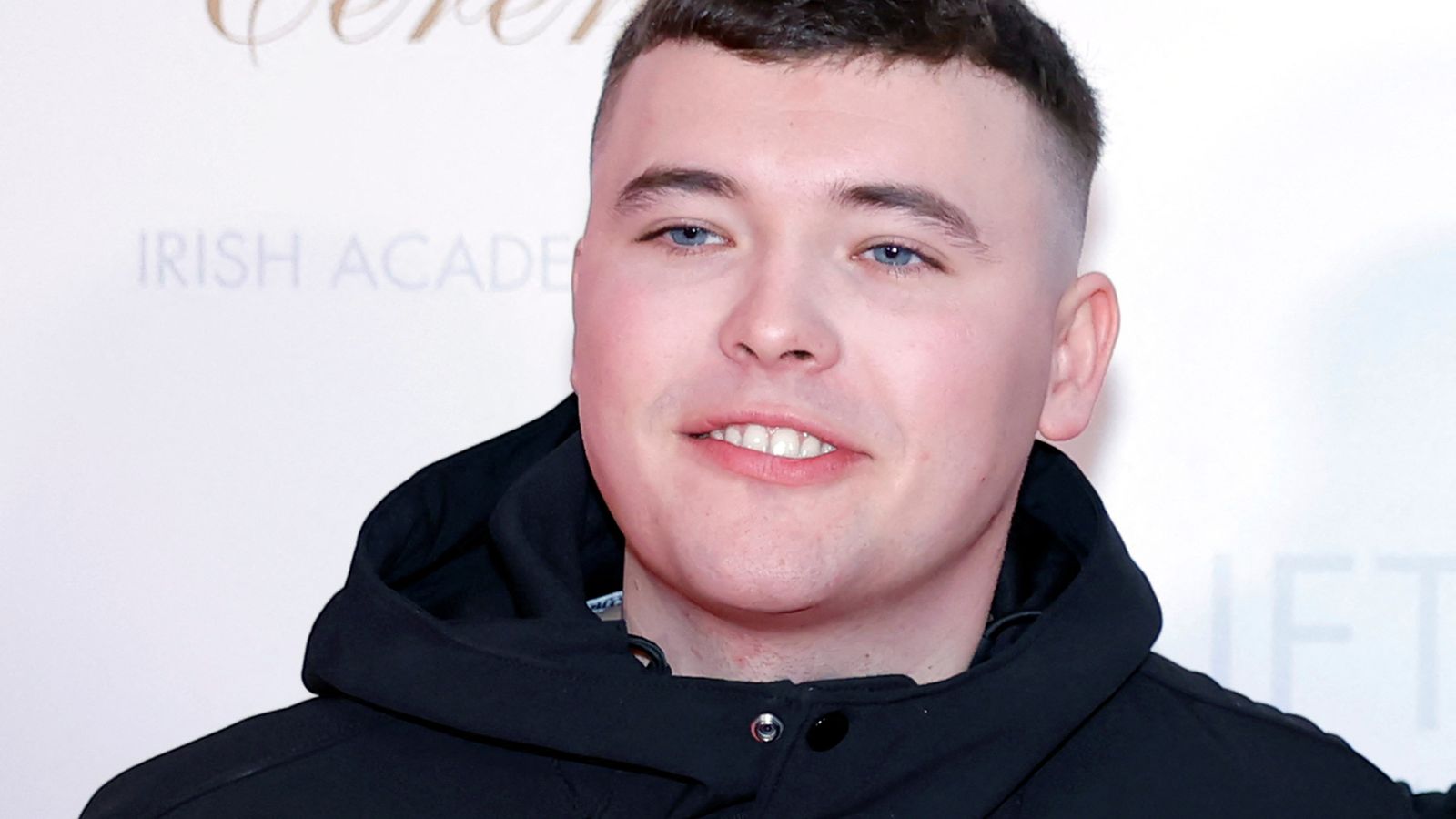 Kneecap rapper appears in court on terror charge as protesters gather outside