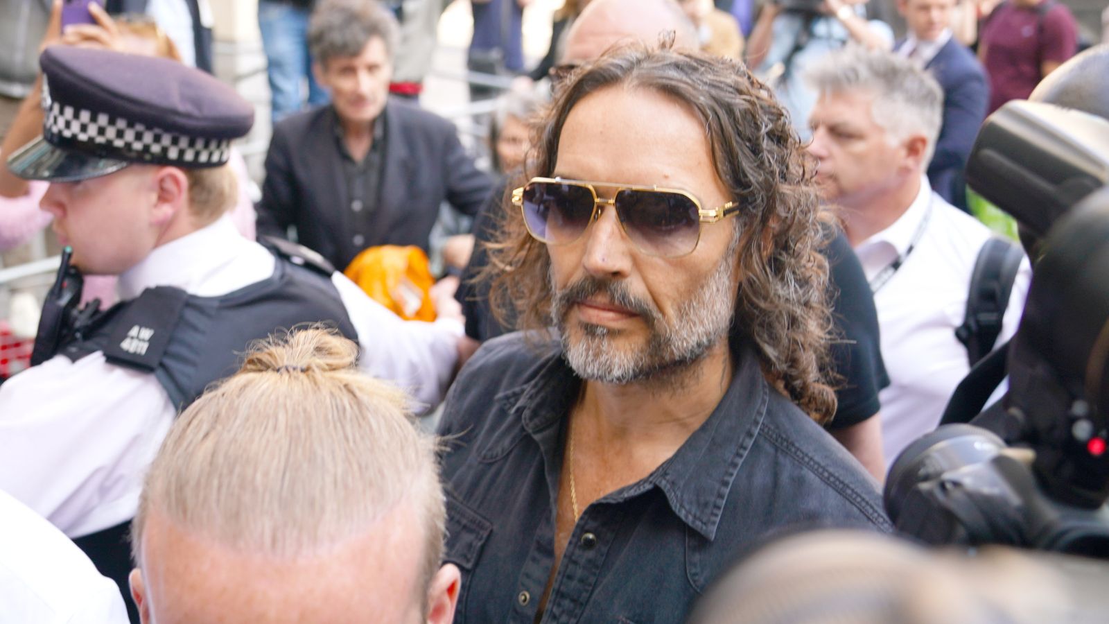 Comedian and actor Russell Brand arrives at Westminster Magistrates' Court after being charged with rape and sexual assault Comedian and actor Russell Brand arrives at Westminster Magistrates' Court after being charged with rape and sexual assault
