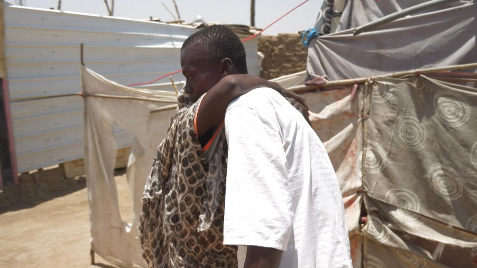 Sudan man separated from his family by war and wounded by a stray bullet, returns home after two years
