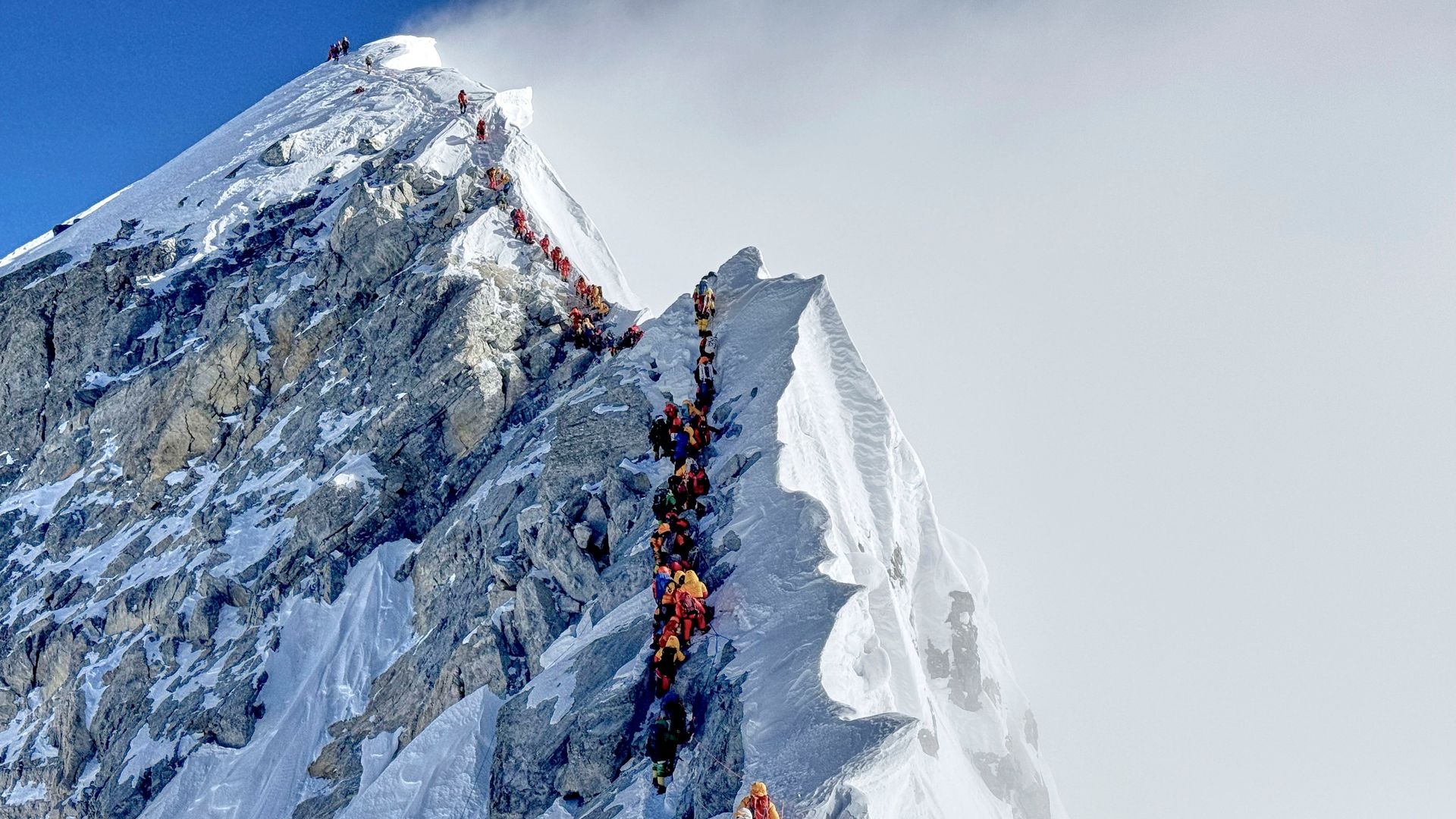 Mount Everest suffers traffic jams as climbers battle harsh weather - with beginners not helping