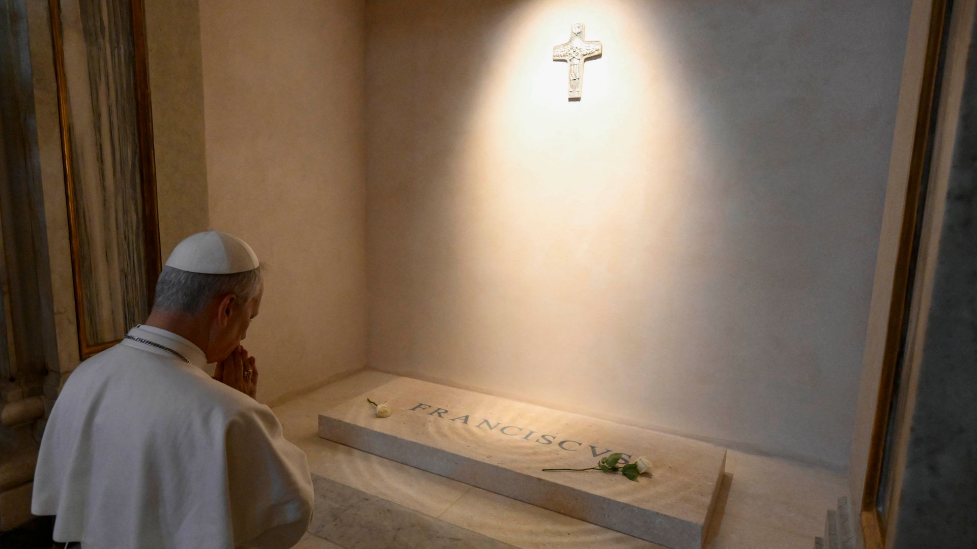Pope prays at tomb of predecessor during first outing since election