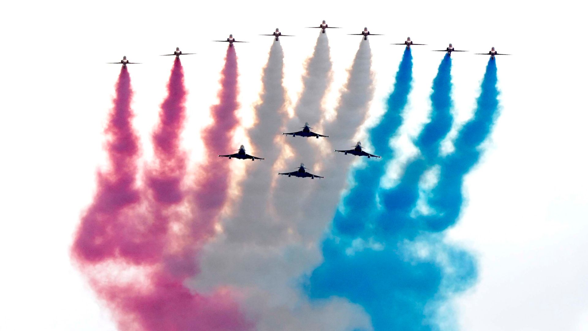 Royals watch flypast as thousands line streets for VE Day parade