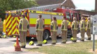 Firefighters in Bicester form a guard of honour for their two colleagues killed. Pic: PA