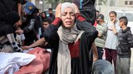 A woman reacts during the funeral of Palestinians killed in Israeli strikes, at Al-Aqsa Martyrs hospital, in Deir Al-Balah in the central Gaza Strip, May 18, 2025. REUTERS/Ramadan Abed TPX IMAGES OF THE DAY
