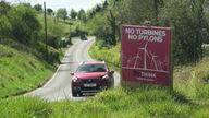 A sign opposing turbines and pylons amid local opposition in parts of Wales