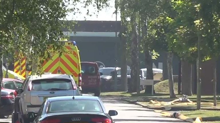 Two firefighters and a member of the public have died in a large fire in Bicester