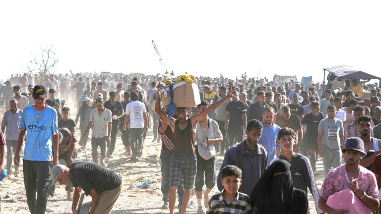 Palestinians carry boxes containing food and humanitarian aid packages delivered by the Gaza Humanitarian Foundation, a U.S.-backed organization approved by Israel, in Rafah.
Pic: AP