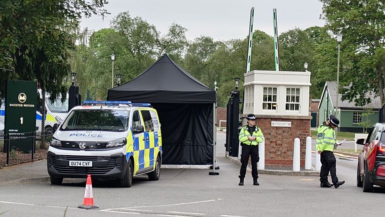 A police cordon near the scene of a fire at Bicester Motion in Oxfordshire, where two firefighters and a member of the public have died, and two firefighters were also seriously injured. A large fire broke out on Thursday at the site of a former RAF base, which is home to more than 50 specialist businesses focused on classic car restoration and engineering. Picture date: Saturday May 17, 2025.