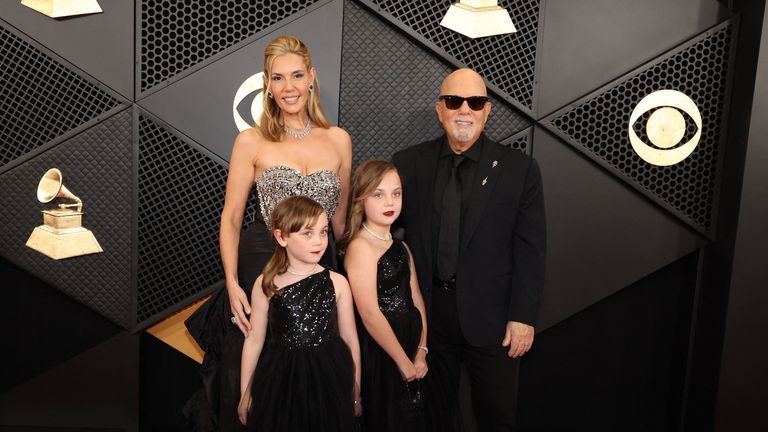 Alexis Roderick, Della Joel, Remy Joel, and Billy Joel pose on the red carpet as they attend the 66th Annual Grammy Awards in Los Angeles, California, U.S., February 4, 2024. REUTERS/Mario Anzuoni
