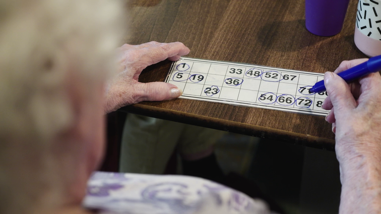 Residents at a care home in Newport play bingo together