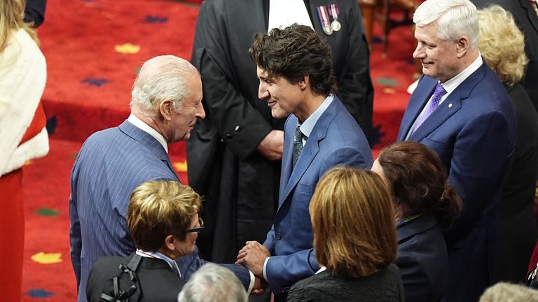 King Charles speaks with former Canadian PM Justin Trudeau. Pic: PA