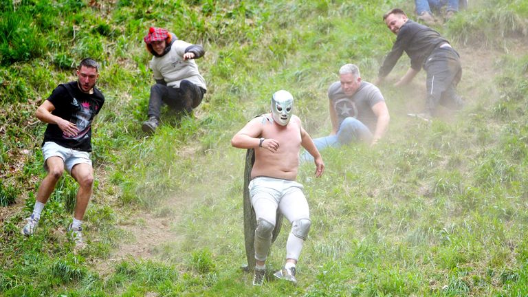Participants instrumentality     portion  successful  the yearly  food  rolling astatine  Cooper's Hill successful  Brockworth, Gloucestershire. 
Pic PA