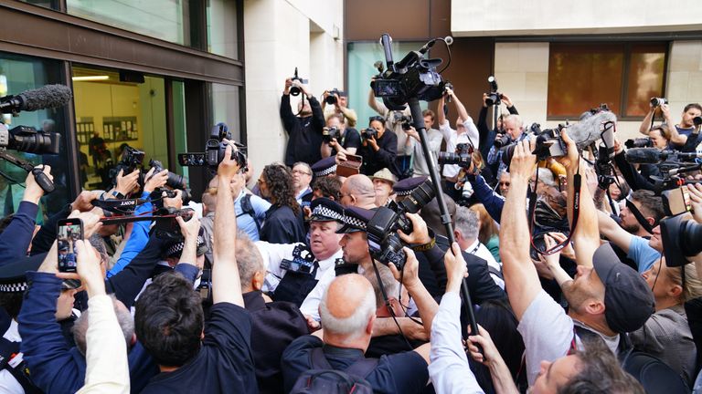 Russell Brand surrounded by media as he arrives at Westminster Magistrates' Court.
Pic: Reuters