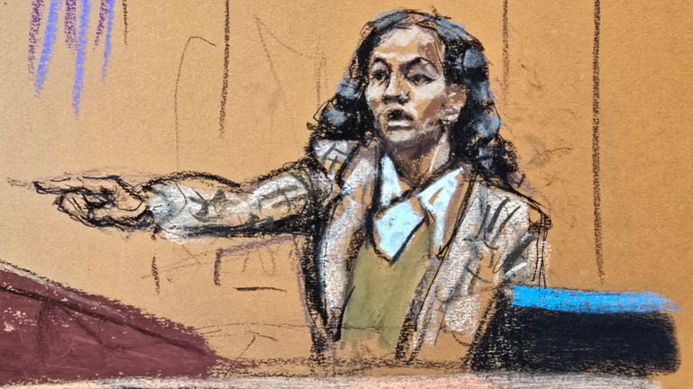 Dawn Richard points at  Combs during the trial. Pic: Reuters/Jane Rosenberg