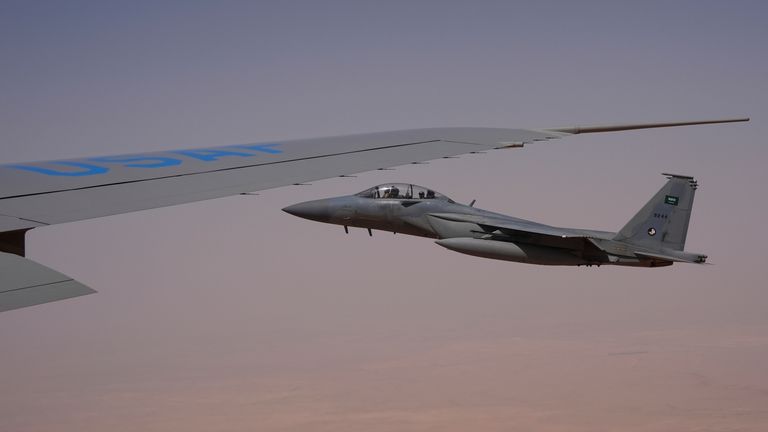 Royal Saudi Air Force F-15s provide an honorary escort for Air Force One. Pic: AP