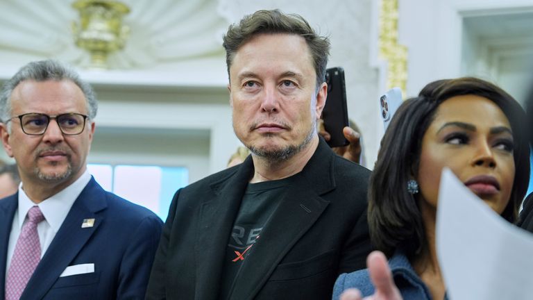 Elon Musk looks on as President Donald Trump meets South African President Cyril Ramaphosa in the Oval Office of the White House, Wednesday, May 21, 2025, in Washington. (AP Photo/Evan Vucci)
