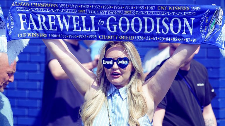 An Everton fan outside the ground. Pic: PA