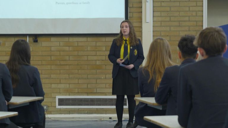Evie gives her presentation at assembly