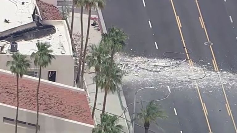 Debris covers the ground after an explosion on Saturday, May 17, 2025 in Palm Springs, Calif.  (ABC7 Los Angeles via AP)