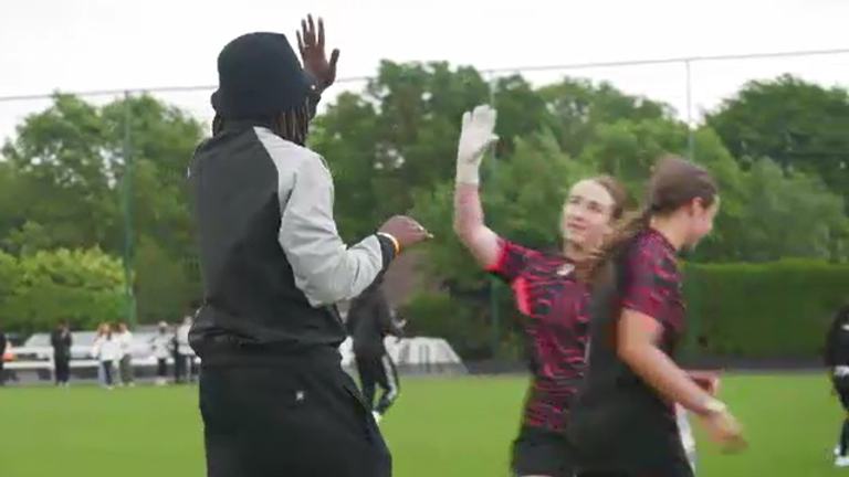 Eze celebrating with some of the players after they won a game during his foundation's tournament