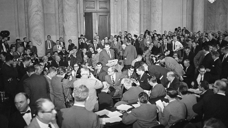Spectators jam the big Caucus Room of the Old Senate Office Building in Washington, March 6, 1962, for Francis Gary Powers' testimony about his U2 flight over the Soviet Union that ended with the plane crashing to earth and Powers parachuting into Russian hands. Powers is seated at the witness table. His attorney, Larry Houston, striped tie, is beside him. (AP Photo)



