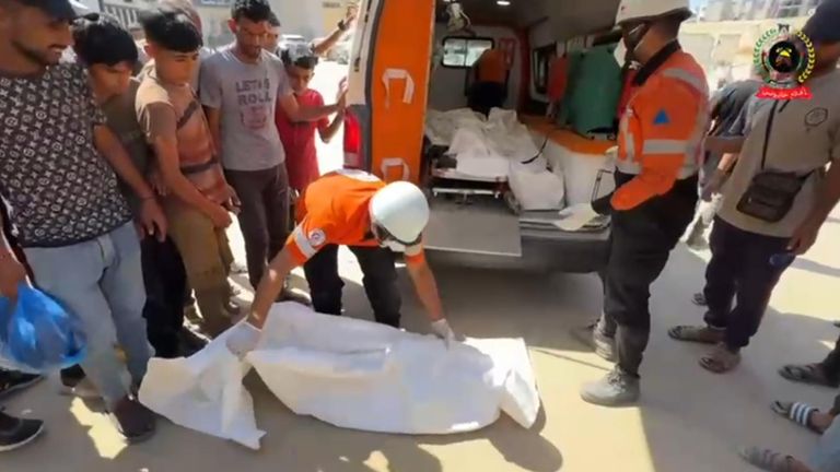 Rescuers unload the children's bodies. Pic: Palestinian Civil Defence