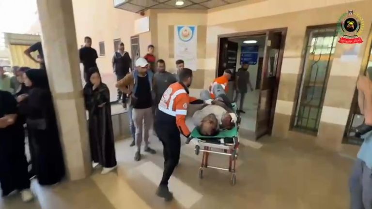 Hamdi Al Najjar, Dr Al Najjar's husband who is also a doctor, being taken into hospital. Pic: Palestinian Civil Defence