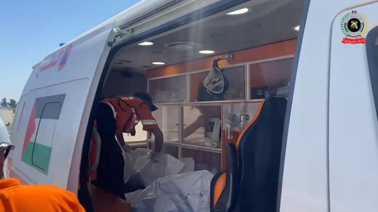 Rescuers placing the children's bodies in a van. Pic: Palestinian Civil Defence