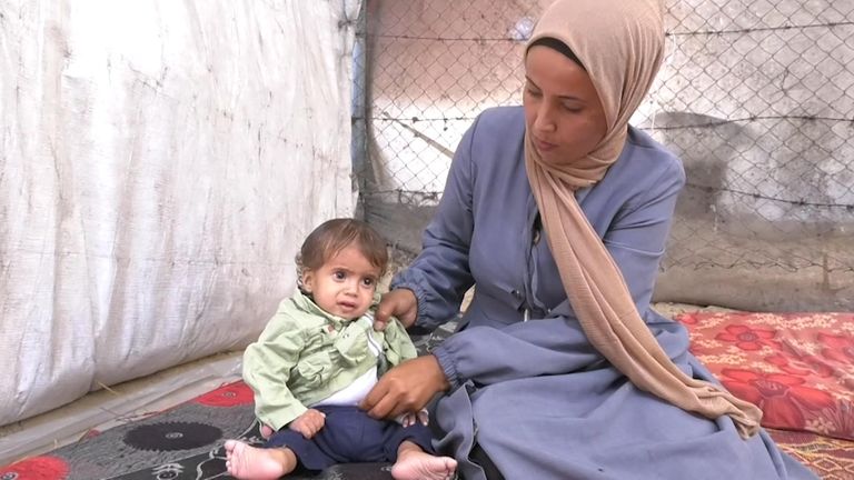 Manal with her one-year-old son Karam 

