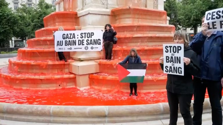 Activists in Paris poured red colouring into the Fontaine des Innocents as they called for an end to the war in Gaza.