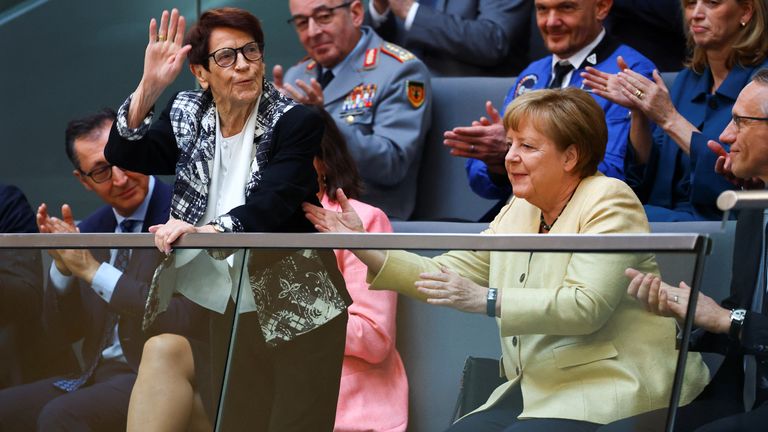 Former German Bundestag President Rita Suessmuth and former German Chancellor Angela Merkel react at the visitors' tribune during the session of the German lower house of parliament Bundestag to elect the new German chancellor, in Berlin, Germany May 6, 2025. REUTERS/Fabrizio Bensch

