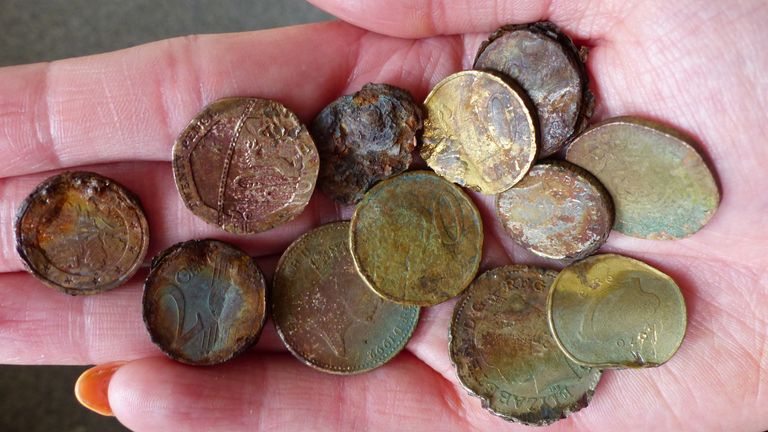 Coins left by visitors at the Giant's Causeway in Co Antrim. Pic: National Trust/PA
